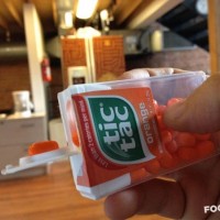 Get a single Tic Tac using the lip of its box