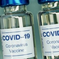 The number of COVID-19 vaccinations administered worldwide exceeds 100 million