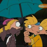 Arnold shares his umbrella with Helga and compliments her pink bow
