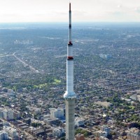 The CN Tower is a concrete communication and observation tower completed in 1976, with a huge metal broadcast antenna on top (the antenna is 102 metre / 334.6 ft tall)
