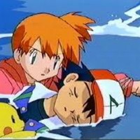 Misty diving in the water to save Ash from drowning