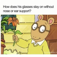 How do Arthur Read's glasses stay on without nose or ear support?